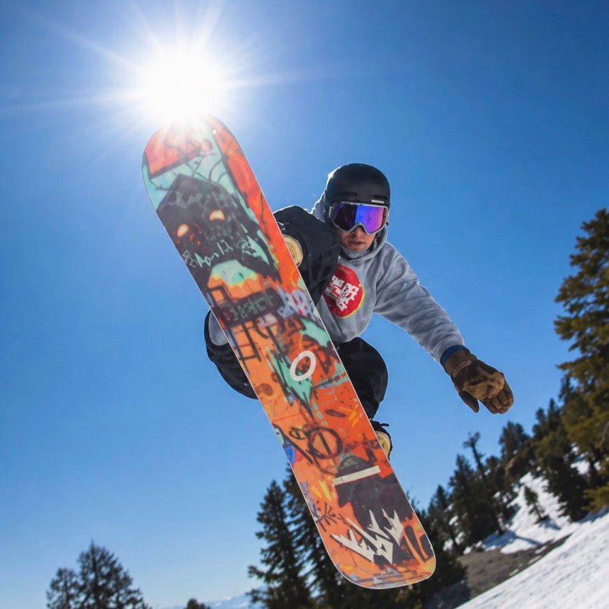 Gabe Taylor riding in MHD Backcountry Pro Tech goggles, method grab, with mirror lens