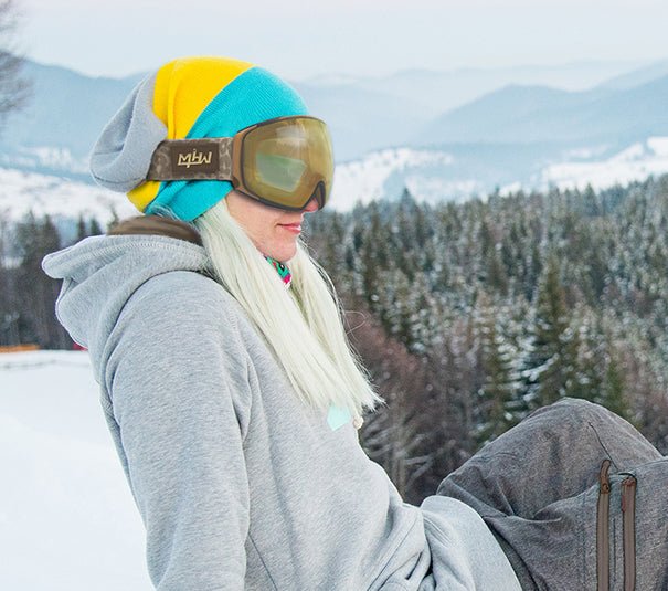 Snowboarder wearing Bad Kitty snow goggles by MHD on snow