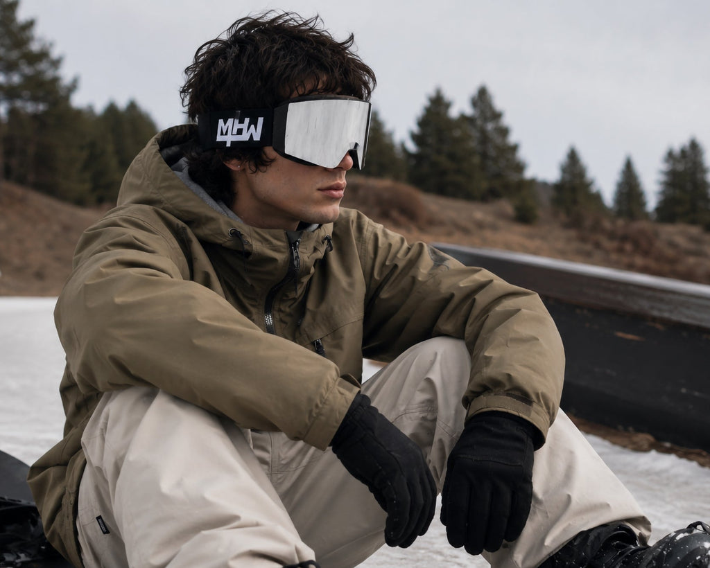 Snowboarder wearing Blacked Out snow goggles by MHD on snow