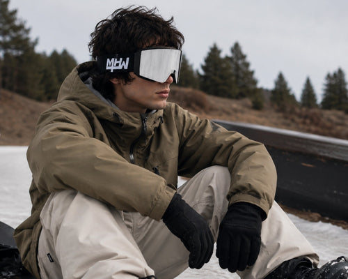 Snowboarder wearing Blacked Out snow goggles by MHD on snow