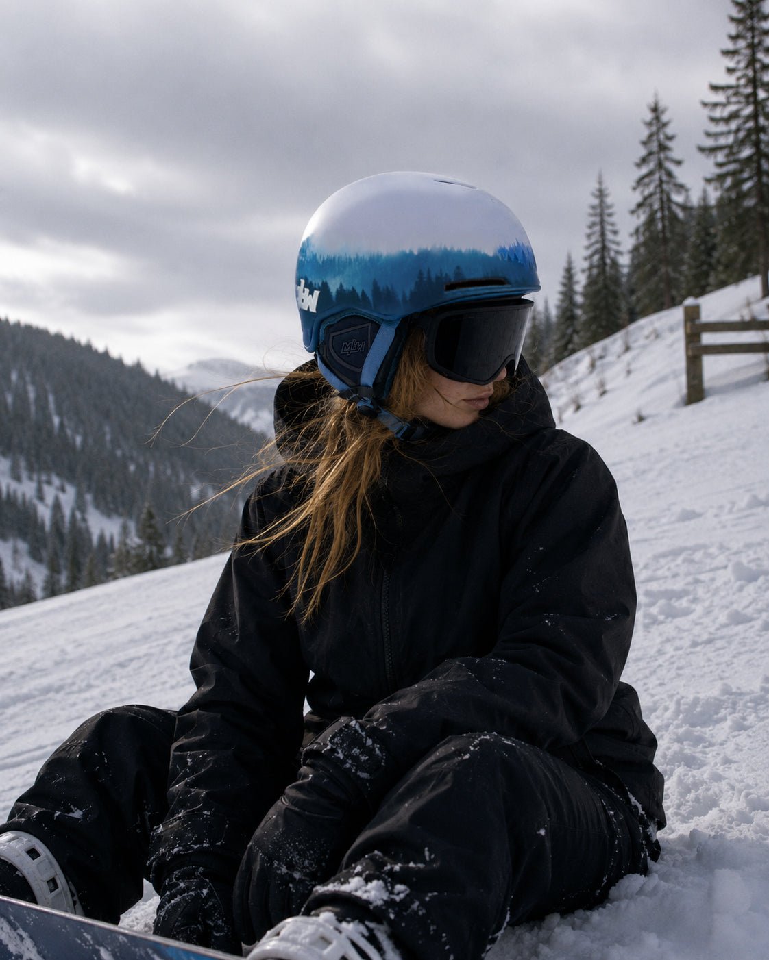 Snowboarder wearing Cirque snowboard helmet by MHD on snow