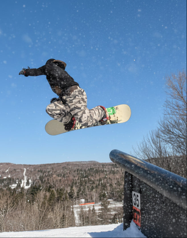 MHD team rider Mathieu Morency doing a grab off a cliff