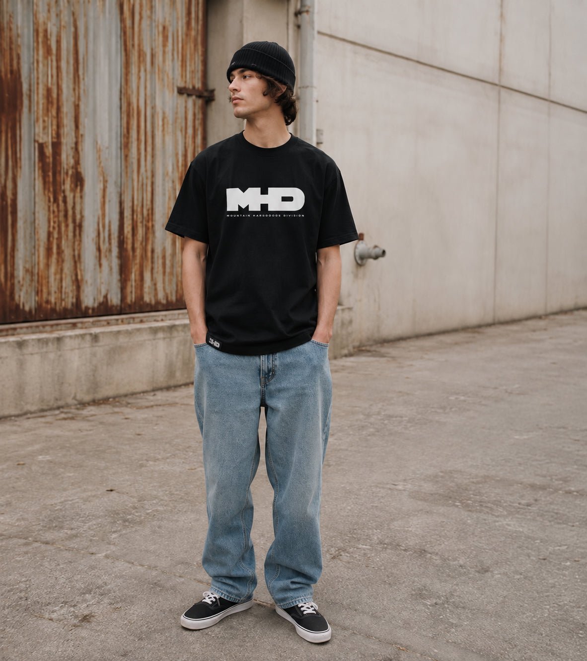 Model wearing the Classic snowboard t-shirt by MHD in black with jeans