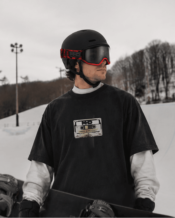 Rider wearing the Mix Tape snowboard t-shirt by MHD with helmet and goggles