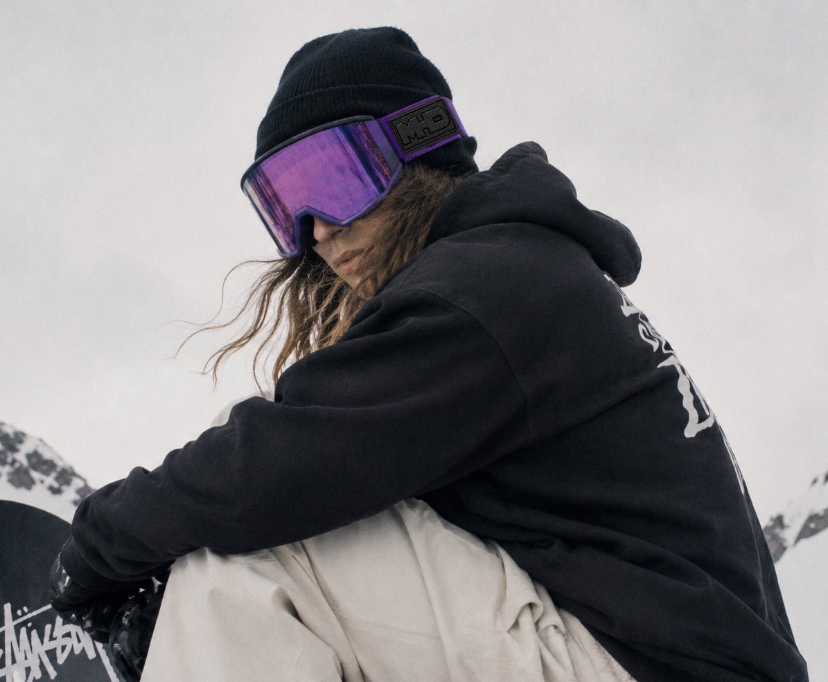 Rider wearing Purple Craze snow goggles by MHD
