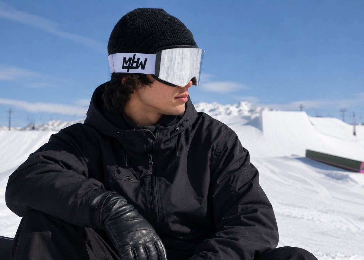Close up of snowboarder wearing Snow Blind  snow goggles by MHD on snow